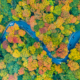 Panoramic view of peak fall foliage in Smugglers Notch Vermont | Shutterstock